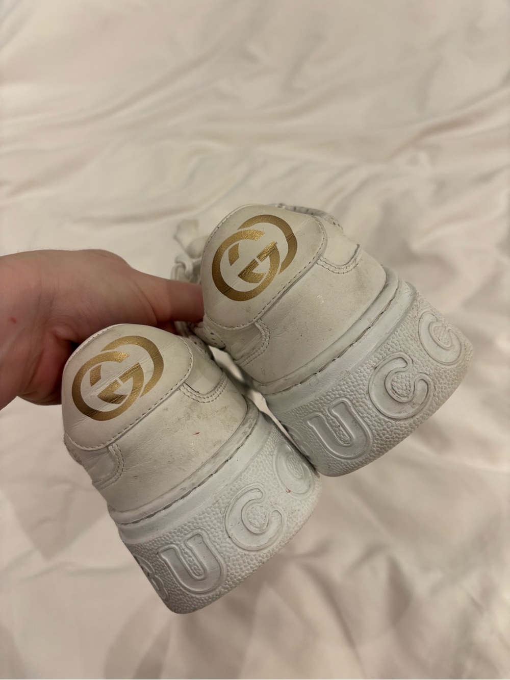 Gucci Women’s GG Embossed White Leather Sneakers with Gold Logo